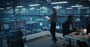 Technology Specialists Activate Information Flows in a Futuristic Data Center, Monitoring Servers, AI Analytics, Cloud Systems, Network Visualization Across Digital Infrastructure. Elevated Shot - Powered by Shutterstock - Get 15% off with code: PIKWIZARD15