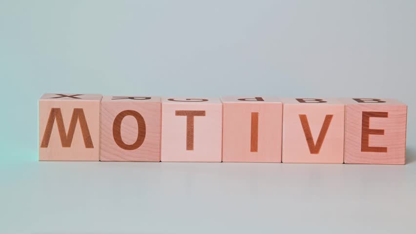 A hand is seen manipulating wooden blocks to form different words focusing on letter arrangement. The activity highlights the process of spelling through interactive play for educational purposes.