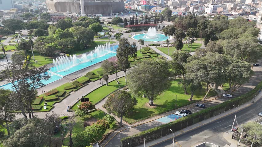 Parque De La Reserva In Lima Capital City Peru. Aerial View Of Green Space Surrounded By Lush Forest Trees. Construction Landscape Skyscrapers Awesome. Construction Urban. Lima capital city.