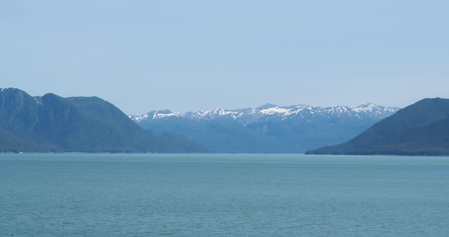 Amazing landscape in Alaska, Juneau. Snow-capped mountains, view from the sea.