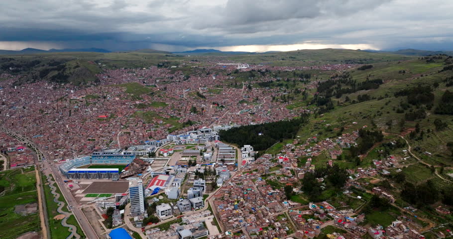 Puno National University of the Altiplano with dense city construction, aerial