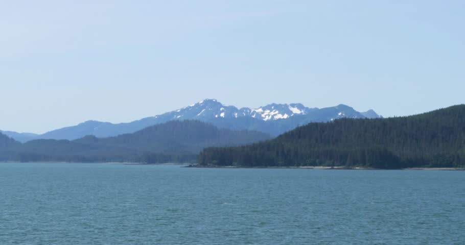 Beautiful snow-capped mountains around Juneau. Alaska in summertime.Sailing around Juneau.