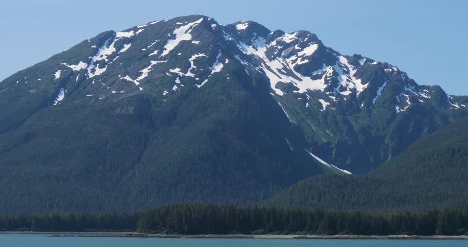 Beautiful landscape of Alaska in summertime, with snow-capped mountains around Juneau,