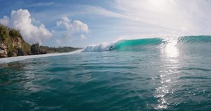 Surfer rides on surfboard at powerful barrel wave. Surfing in ocean - Powered by Shutterstock - Get 15% off with code: PIKWIZARD15