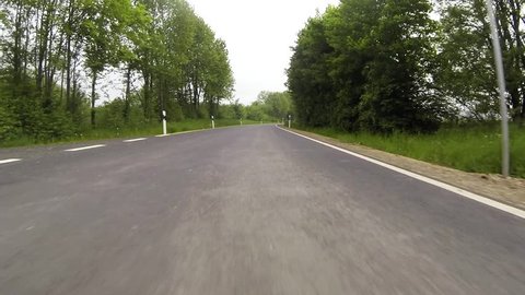 Actioncam: Gopro, driving in a green landscape