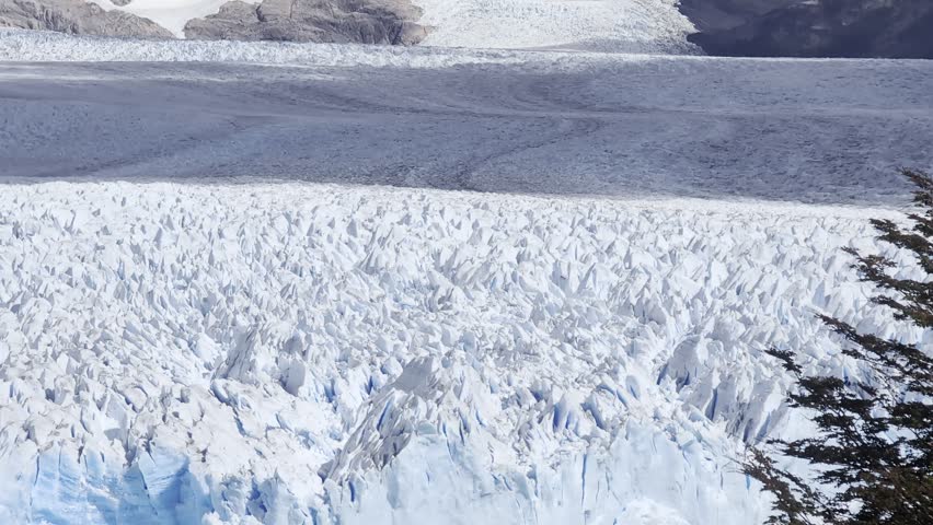Close-up of the ice surface of the Perito Moreno Glacier. El Calafate, Santa Cruz, Argentina. Patagonia. Cloudy day. Stunning landscape.
