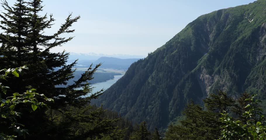 Mount Juneau viewed from Mount Roberts, Gastineau channel and Chilkat Mountain range in the background. Juneau, Alaska.