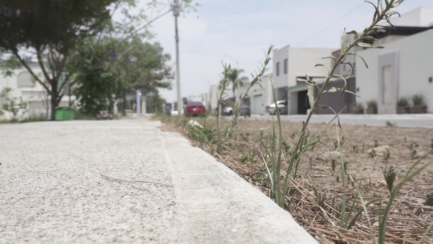 A slow motion shot of a remote control car drifting in front of the camera