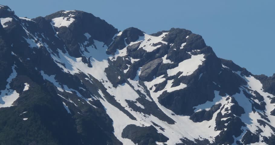 Majestic snow-capped mountain around Juneau, Alaska in summertime.
