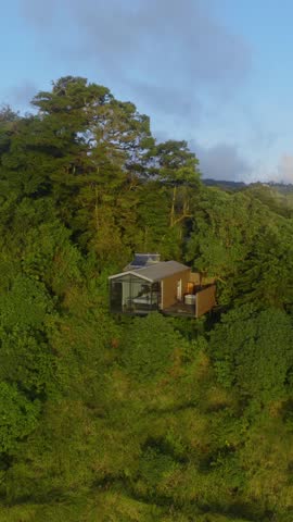 Early Morning Aerial View of a Modern House Nestled in a Lush Mountain Forest, Costa Rica
