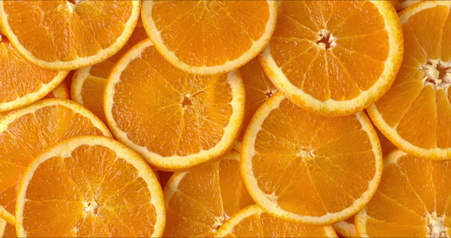 Top view of unpeeled orange slices as a background texture.