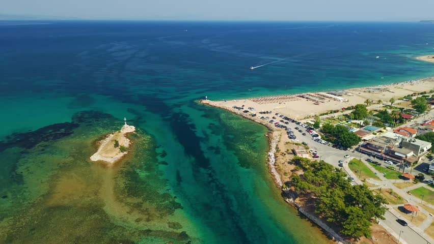Aerial View of Nea Poteidaia Canal, turquoise water connects the two sides of the Kassandra peninsula in Chalkidiki, Greece.