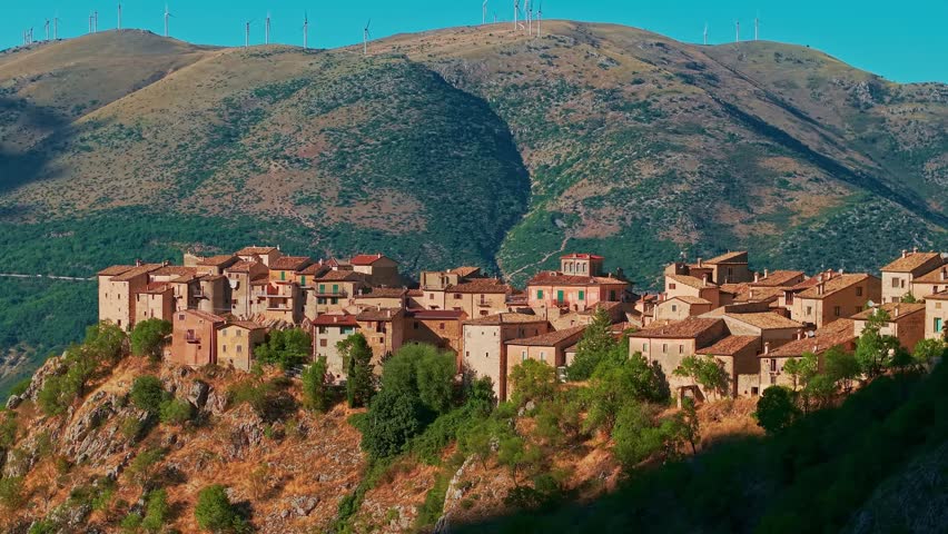 Spectacular aerial view of the tiny medieval village of Castrovalva perched on a dramatic hilltop. Located in the Abruzzo region of Italy, famous for its wild landscape and Escher inspiration.