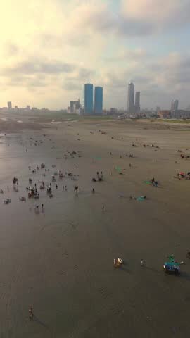People enjoying holiday at clifton sea view beach, Karachi Pakistan 