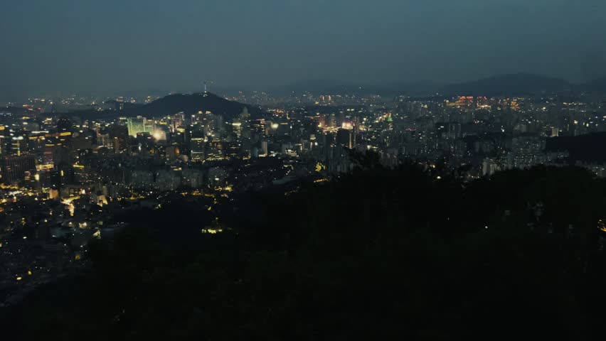 Mountain top night view of urban city skyline of Seoul in South Korea, Asia.