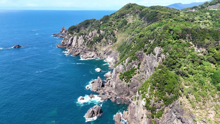 Wide aerial view of the rugged coastline and blue ocean of West Izu, Japan. Scenic rias coast with cliffs.
