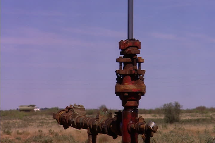 Piston moves up and down on oil well pump jack in Midland, Texas.