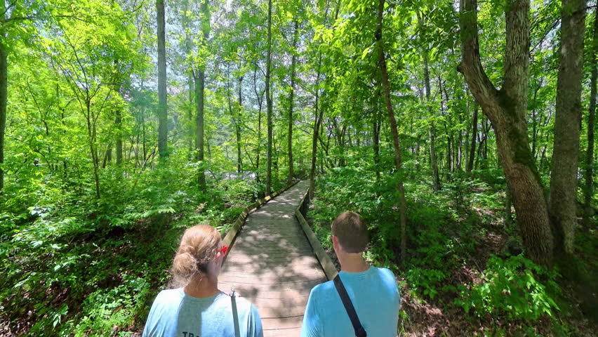 Couples Hikes Over Boardwalk Trail in New River Gorge National Park
