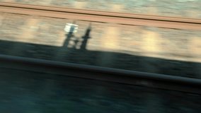 Train shadow moving along railway tracks during travel - Powered by Shutterstock - Get 15% off with code: PIKWIZARD15