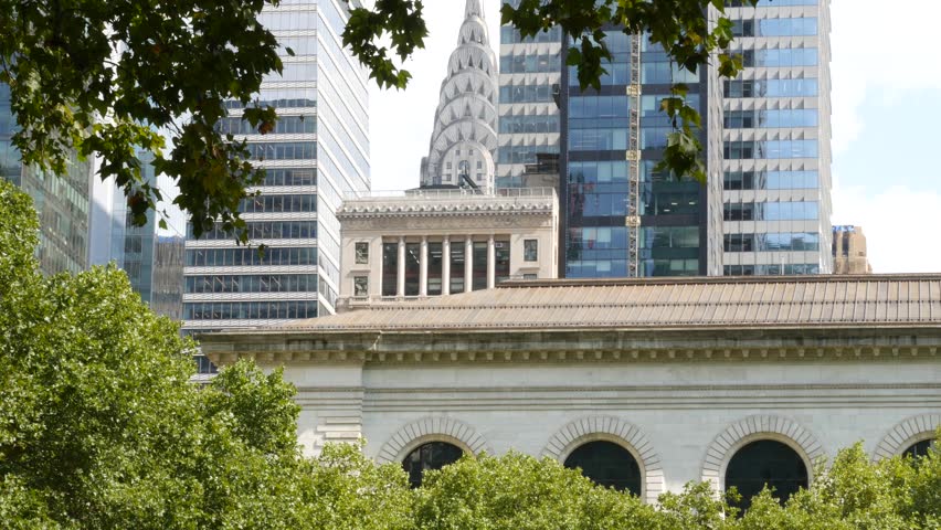 New York City Manhattan Midtown United States of America. Bryant park library building on 42 street 5 fifth avenue. Skyscraper skyline urban cityscape. High-rise tower, summer greenery. Public library