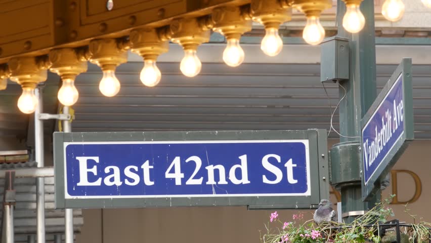 Grand Central Terminal on East 42 street, New York City Manhattan Midtown roadsign. Details of railway building entrance in United States. American public railroad transport. Road sign and light bulbs