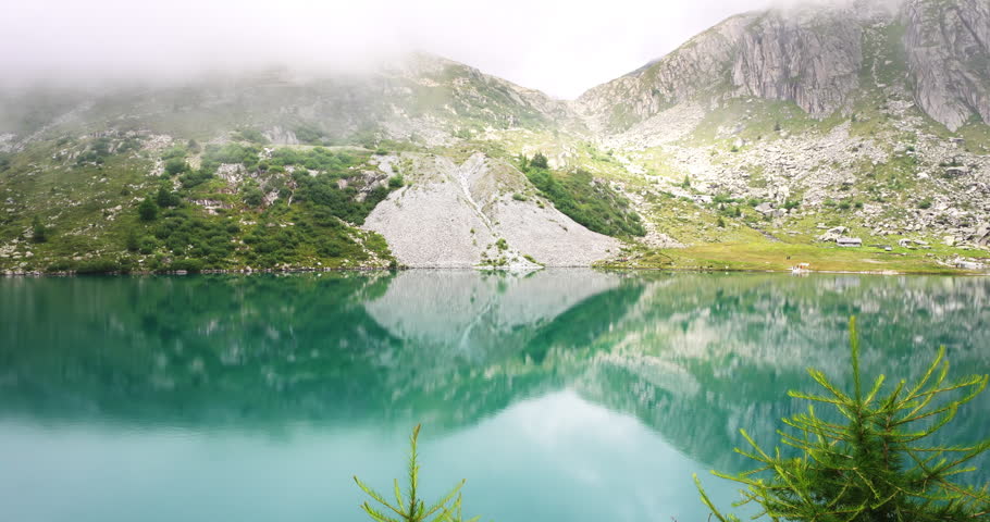 Landscape with fog over lake Cornisello