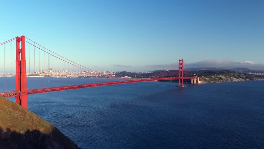Golden Gate Bridge aerial view over San Francisco Bay on sunny day