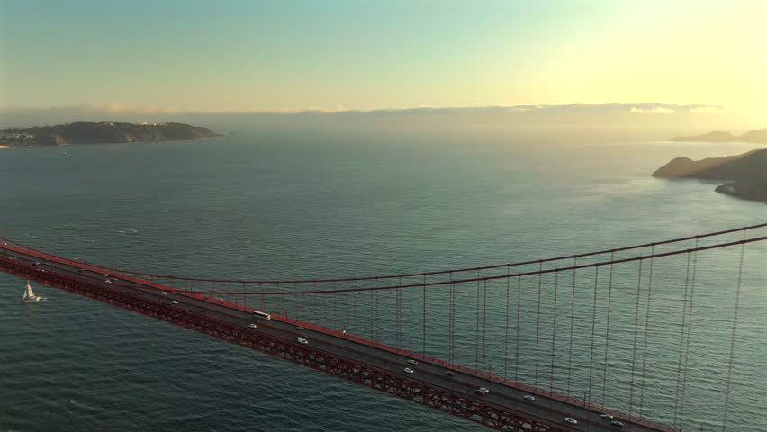 Golden Gate Bridge aerial view at sunset over San Francisco Bay