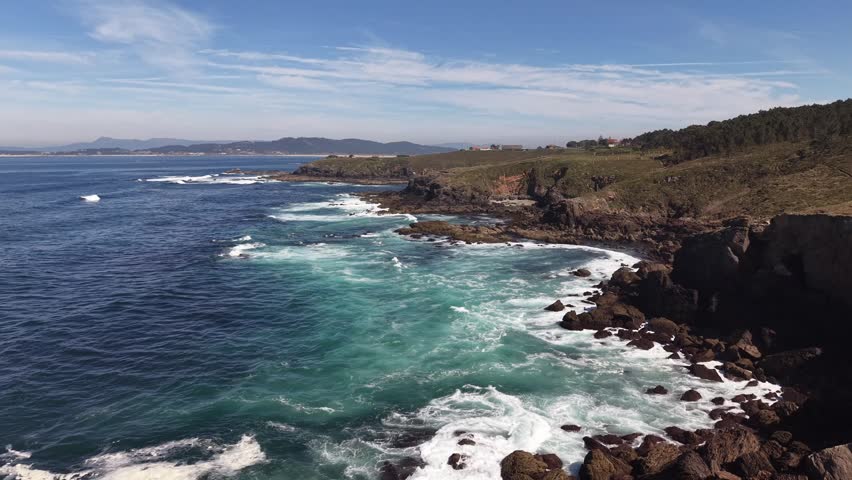 Rugged atlantic coastline featuring cliffs, waves, and a natural landscape