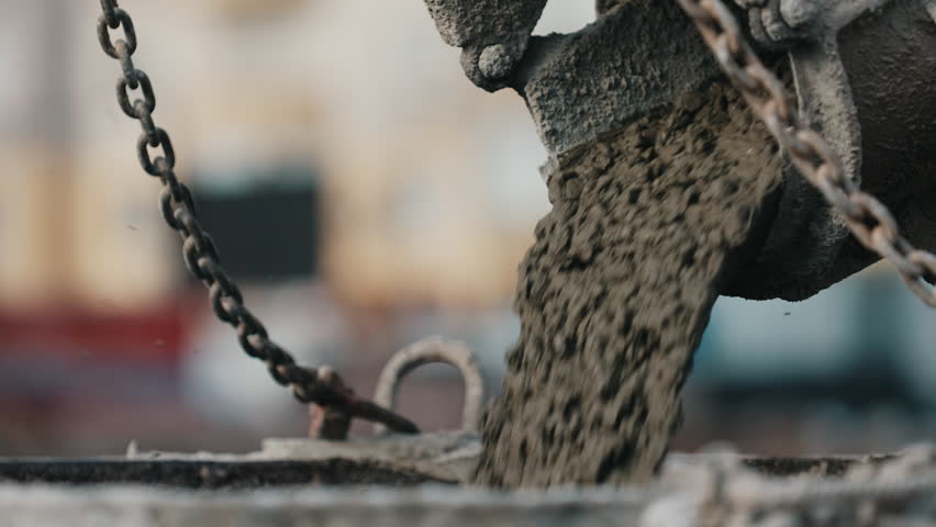 Pouring concrete during foundation construction close up