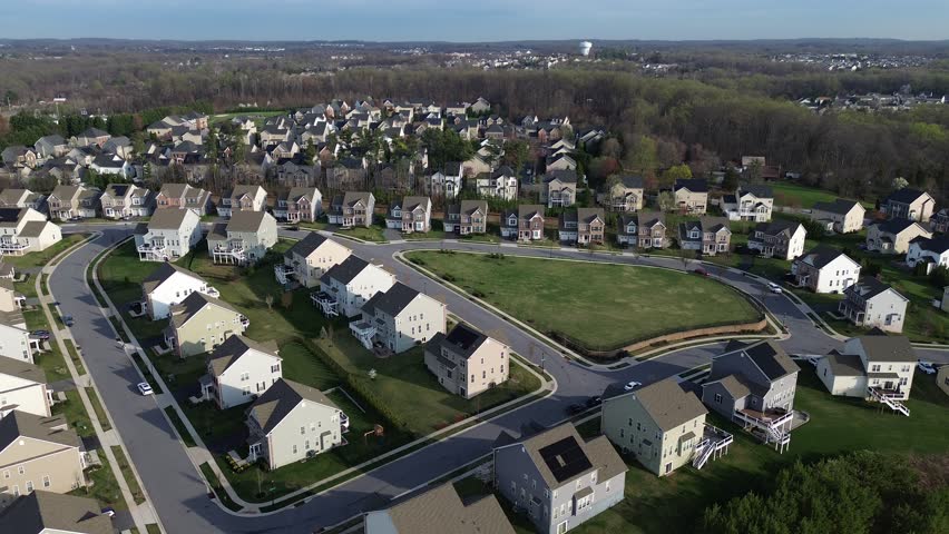 Central green overlook highlights community open space along Straw Lily Way with wooded edges connecting loops extending toward Forge Road in Perry Hall area, Maryland. USA