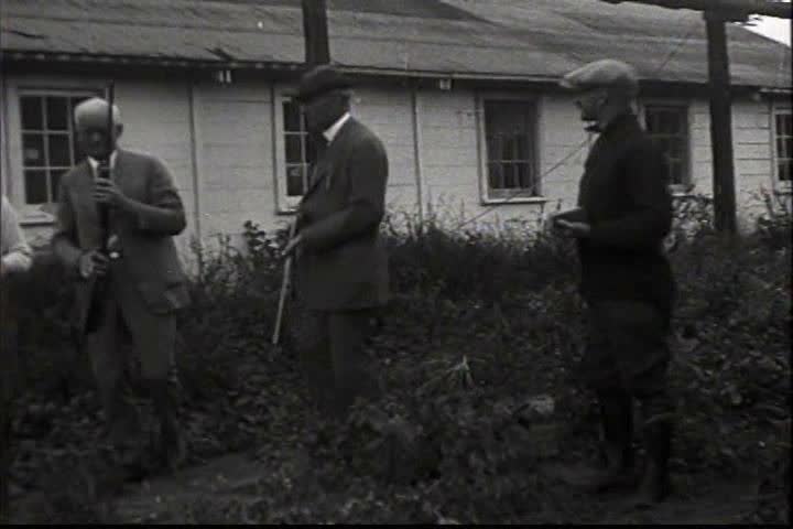 1910s - Men shoot a variety of guns and pistols in 1919.