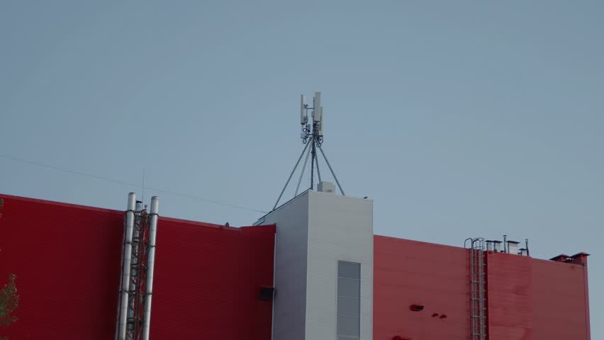  Bright red building facade under a clear blue evening sky