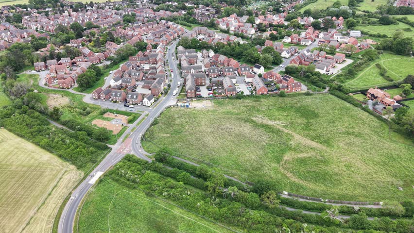 Aerial view over a new housing estate built on green belt land, United Kingdom