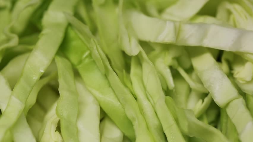Cabbage salad close-up, fresh cabbage chopped in the kitchen, healthy eating