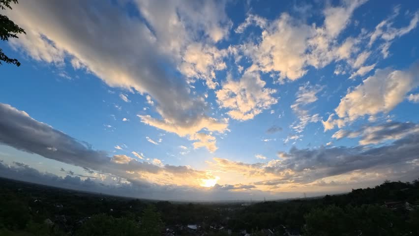 Dynamic Cloud Timelapse Over Rural Landscape and Green Fields