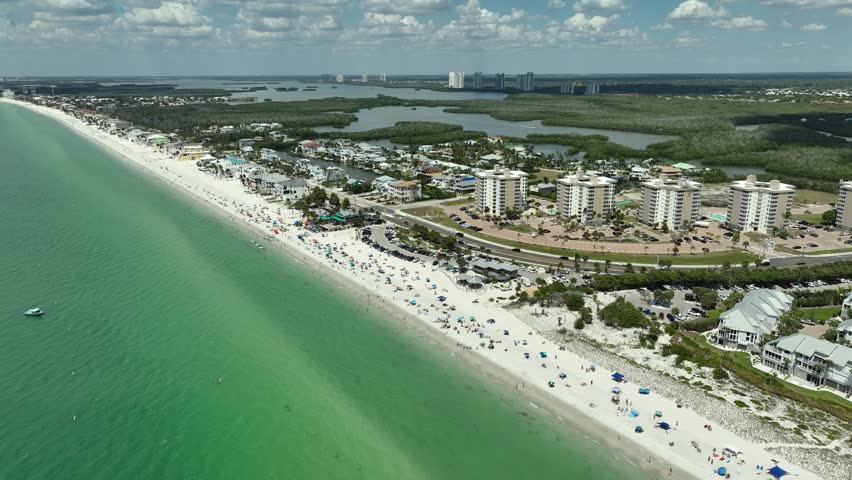 Where mangrove labyrinths meet the Gulf — an aerial glimpse of Bonita Beach, Florida, where tide, town, and tropical wilderness quietly collide.
