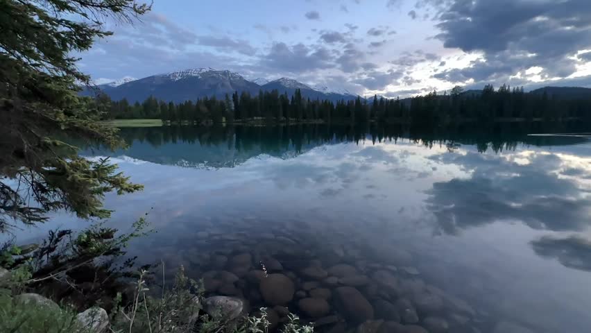 Beauvert Lake is one of the most picturesque lakes in Canada reflecting the breathtaking alpine mountain landscapes of Jasper National Park, Alberta, Canada.
