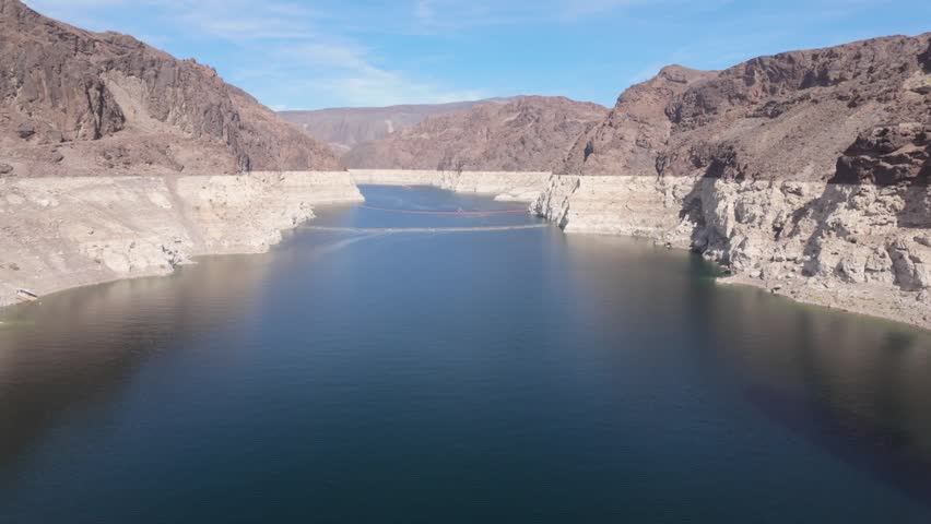 The Lake Mead Reservoir in Nevada that leads up to the Hoover Dam. The white mineral edge on the rocks around show the falling water level.