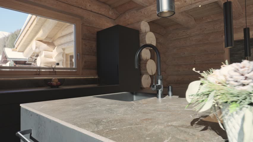 Modern kitchen with black furniture inside a rustic wooden log cabin showing contemporary design