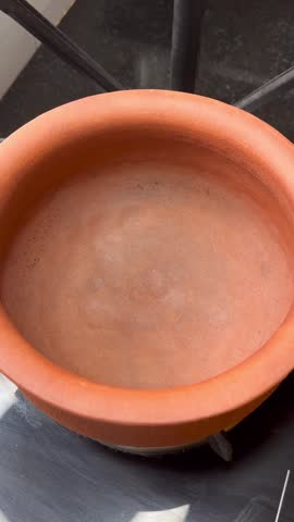 Earthen pot filled with fresh water 