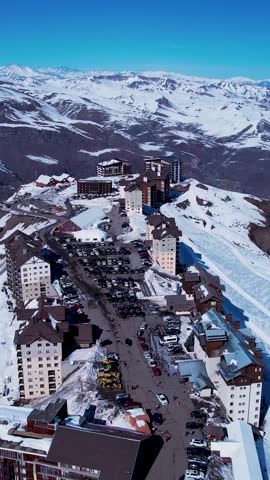 Santiago Chile. Ski station center at snowing Andes Mountains near Santiago Chile. Snow mountain landscape at winterness. Winter ness travel destination. Winter ness tourism travel.