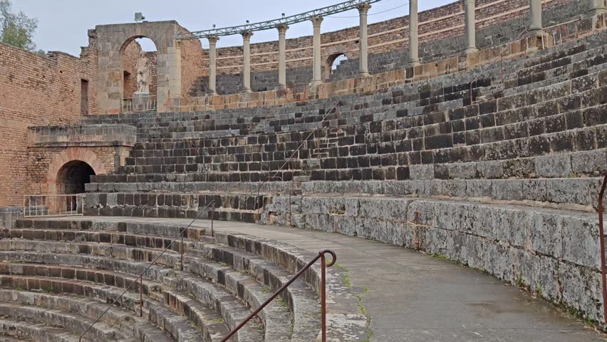 Grand View of the Ancient Roman Theater with Amphitheater Seating and Majestic Columns in Guelma, Algeria