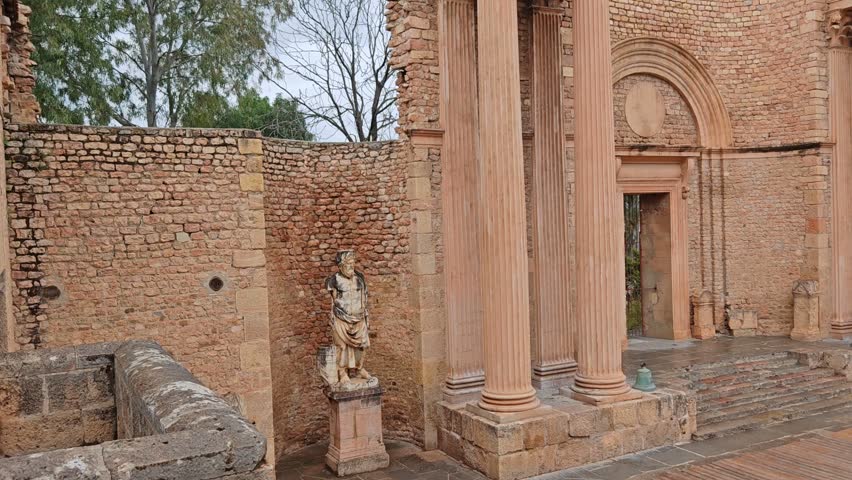 Grand View of the Ancient Roman Theater with Amphitheater Seating and Majestic Columns in Guelma, Algeria