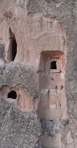 Aerial Vertical View of Ancient Cave Dwellings Carved into Rock Formations in Cappadocia, Turkey