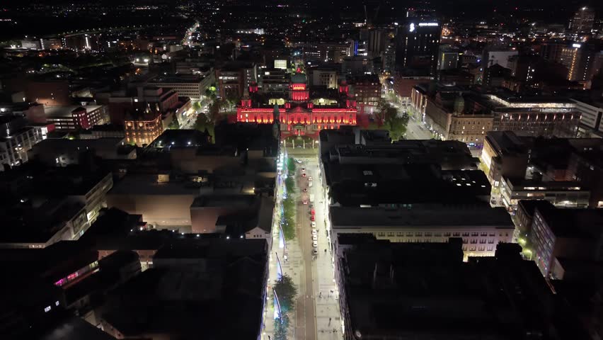 Wide advancing 4K 60FPS aerial of Belfast City Hall in Belfast City Centre at night. Produced in 3840x2160 and with Rec709 color.