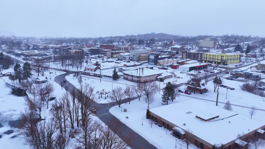 Cadillac Michigan, USA downtown in winter, a small American city aerial view covered with snow