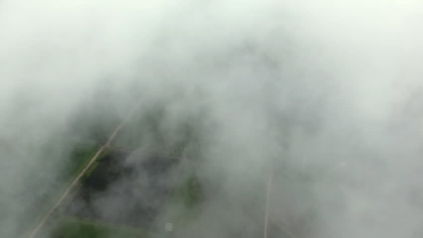Aerial view showing dense clouds in the countryside,