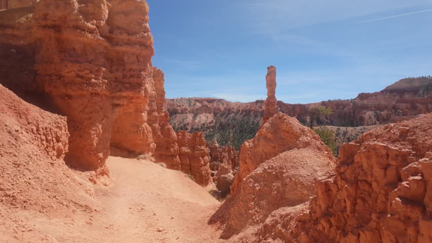 A POV shot hiking through the colorful red rocks of Bryce Canyon National Park.