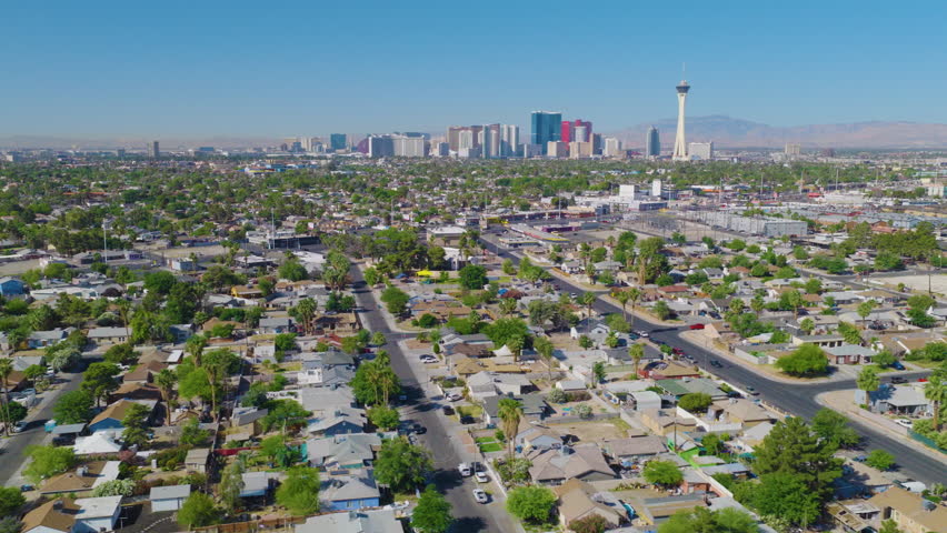 Las Vegas Lateral Aerial View of Strip Skyline Over Residential Neighborhood 01
